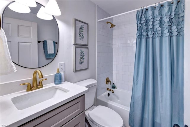 full bathroom featuring vanity, shower / bath combination with curtain, and toilet