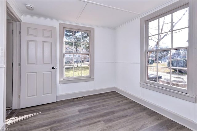 empty room with hardwood / wood-style flooring