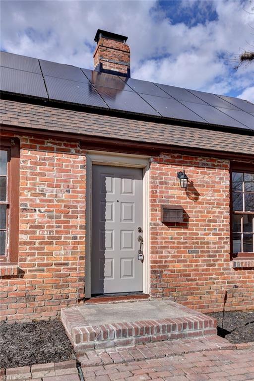 entrance to property featuring solar panels