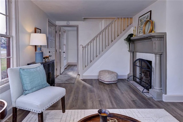 sitting room with dark hardwood / wood-style flooring