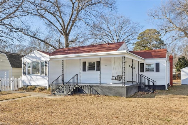 view of front of house with a porch and a front lawn