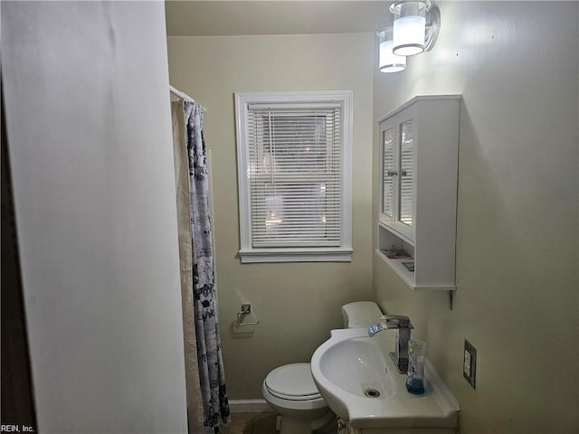 bathroom with toilet and sink