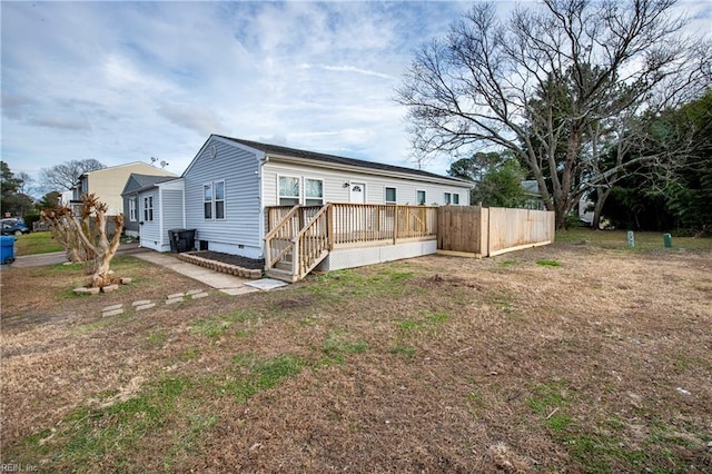 view of side of home featuring a deck