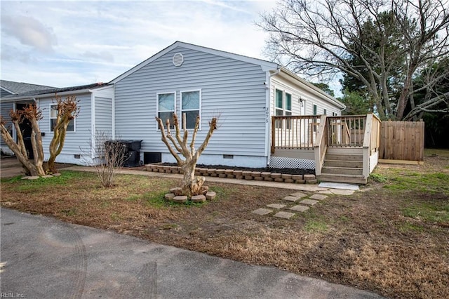 view of side of property with a deck