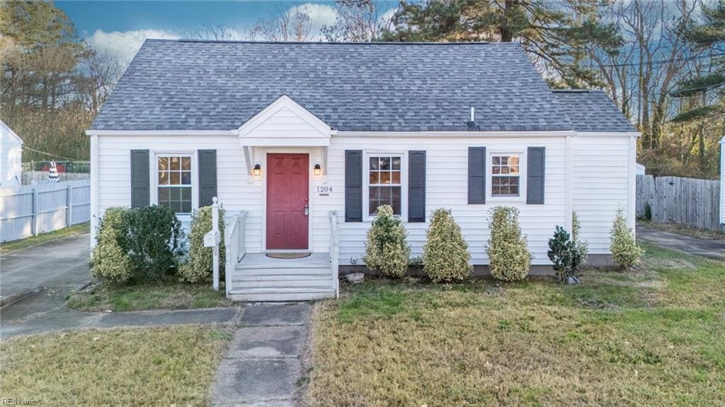 view of front of property with a front lawn