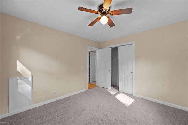 unfurnished bedroom featuring light carpet, a closet, and ceiling fan