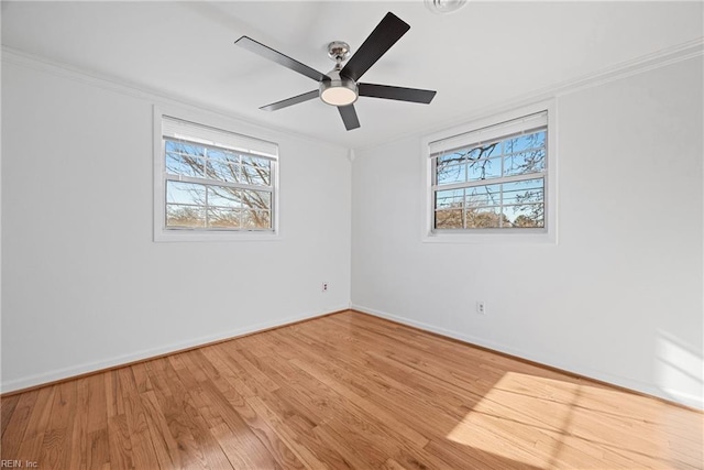 unfurnished room with light hardwood / wood-style flooring, ceiling fan, and ornamental molding