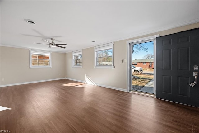 entryway featuring dark hardwood / wood-style floors, ceiling fan, and ornamental molding