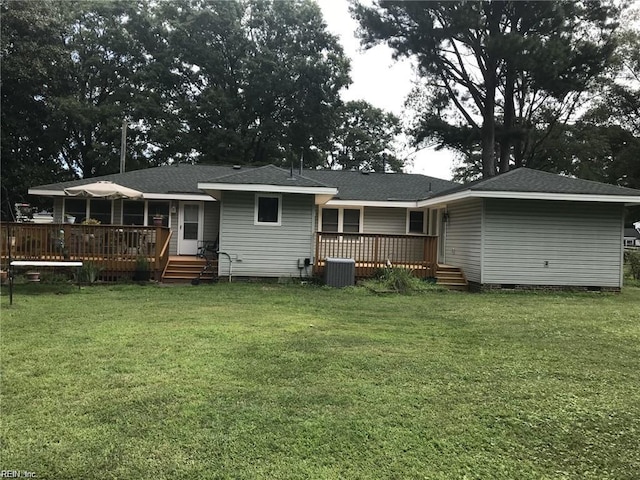 rear view of property with central AC, a yard, and a deck