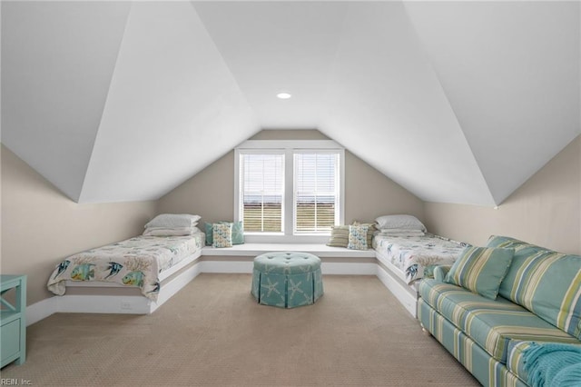 bedroom featuring light carpet and vaulted ceiling