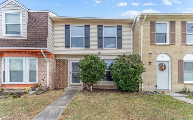 view of property featuring a front yard