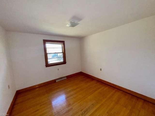 unfurnished room featuring wood-type flooring