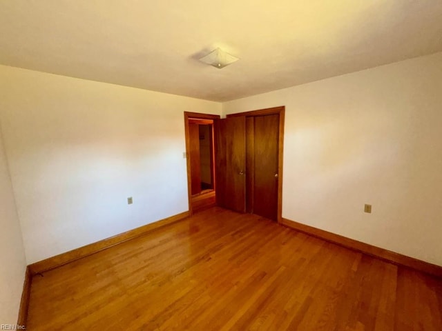 empty room featuring hardwood / wood-style floors