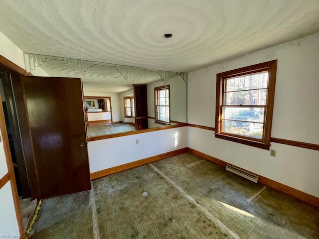 carpeted spare room with a healthy amount of sunlight