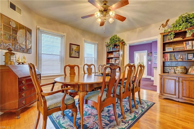 dining space featuring ceiling fan and light hardwood / wood-style flooring