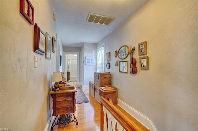 hallway featuring light hardwood / wood-style flooring