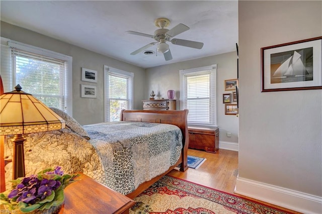 bedroom featuring light hardwood / wood-style flooring and ceiling fan