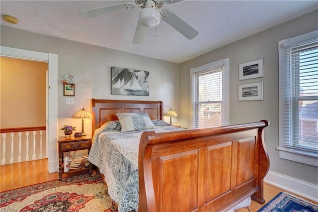 bedroom featuring ceiling fan and light hardwood / wood-style flooring