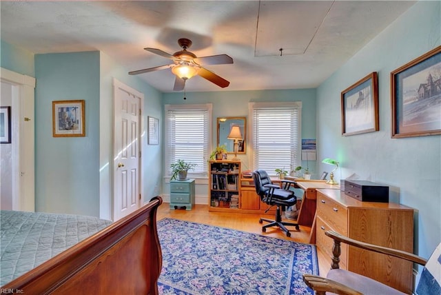 bedroom featuring light hardwood / wood-style floors and ceiling fan