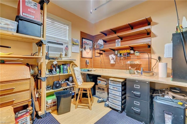 office area featuring wood walls