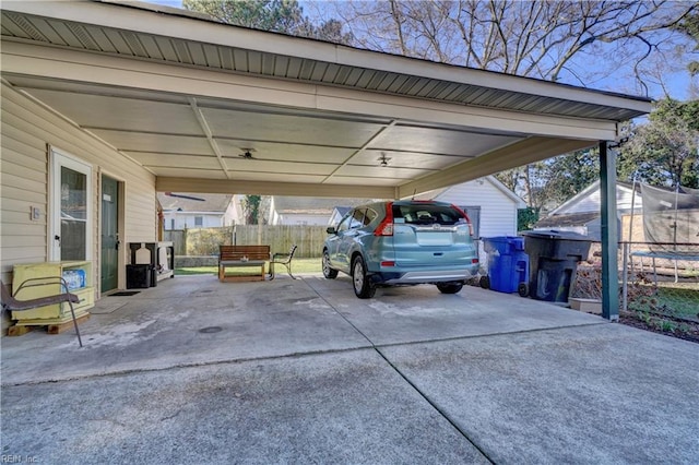 view of vehicle parking featuring a carport