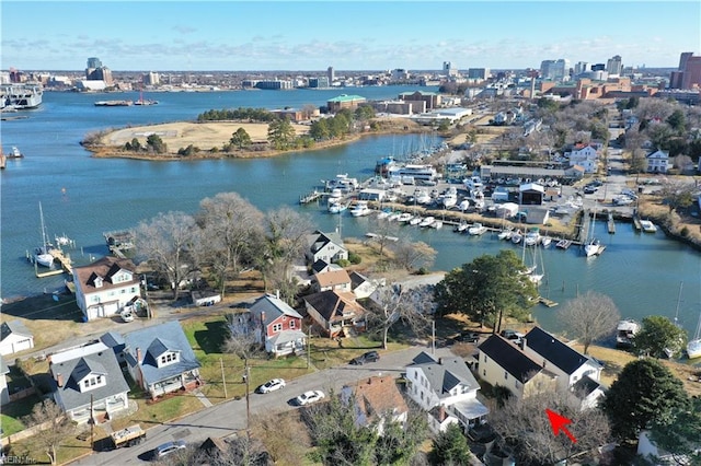 birds eye view of property with a water view