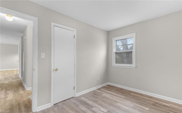 spare room featuring light hardwood / wood-style flooring