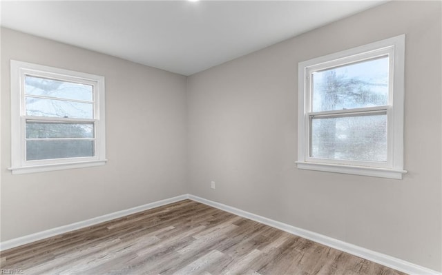 unfurnished room featuring light hardwood / wood-style flooring