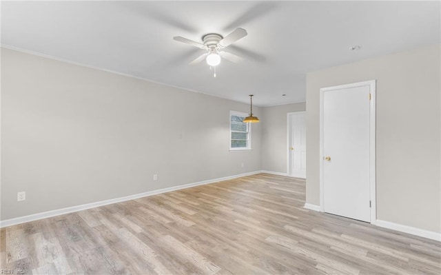 spare room with light hardwood / wood-style floors and ceiling fan