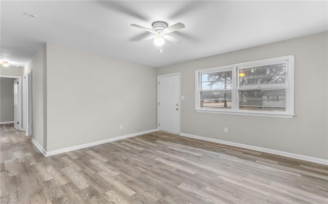 unfurnished room featuring light wood-type flooring and ceiling fan