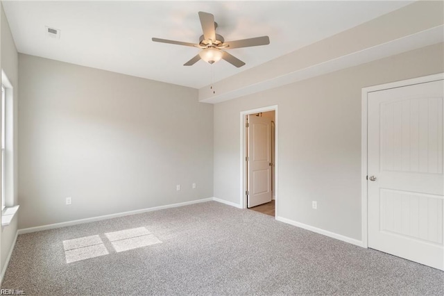 unfurnished bedroom with ceiling fan and carpet floors