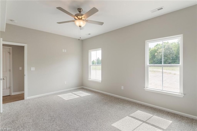 carpeted empty room with ceiling fan