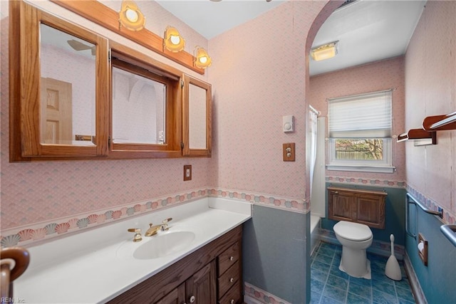 bathroom featuring vanity and toilet