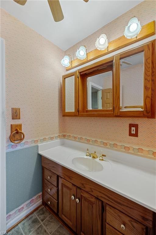 bathroom featuring ceiling fan and vanity