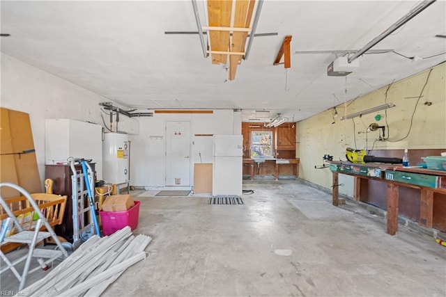 garage with a workshop area, water heater, white fridge, and a garage door opener