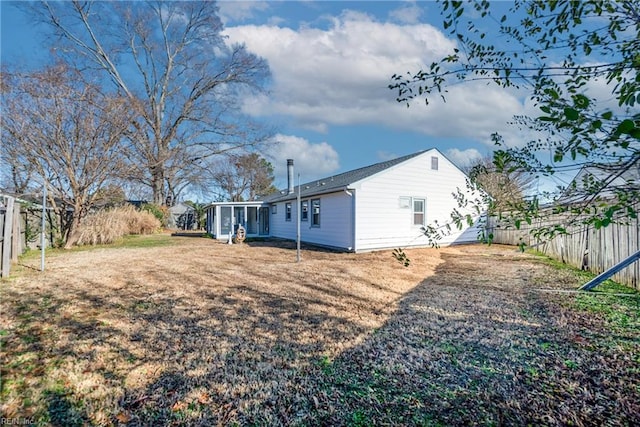 view of yard featuring a sunroom