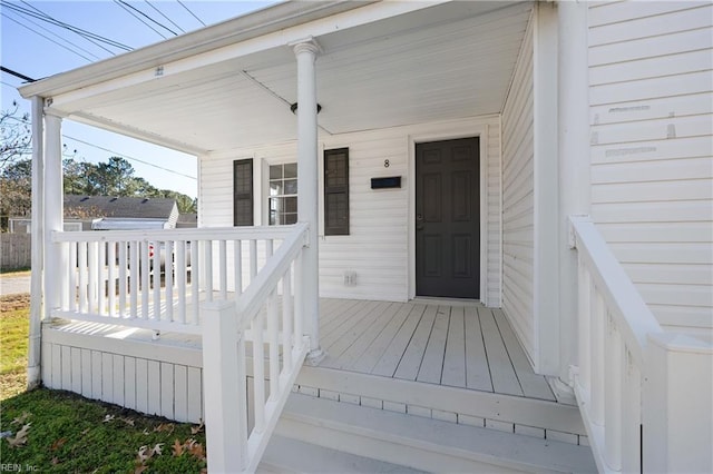 wooden deck featuring covered porch