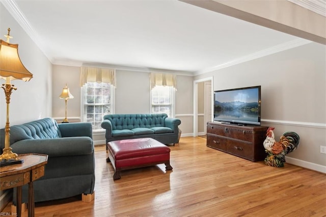 living room with light hardwood / wood-style floors and crown molding