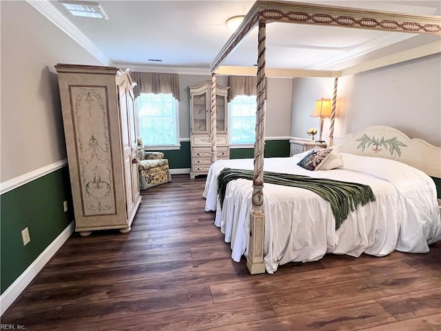 bedroom featuring crown molding and dark hardwood / wood-style floors