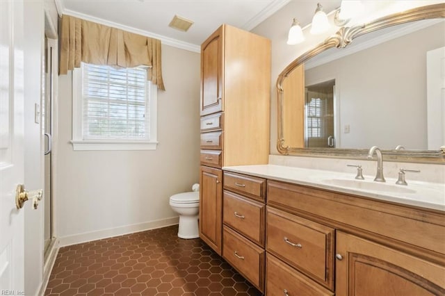 bathroom featuring vanity, toilet, and ornamental molding