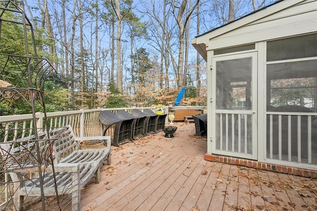 deck featuring a hot tub