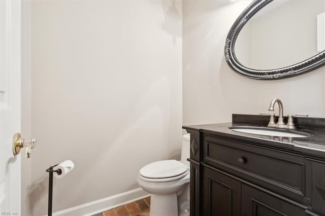 bathroom featuring hardwood / wood-style floors, vanity, and toilet