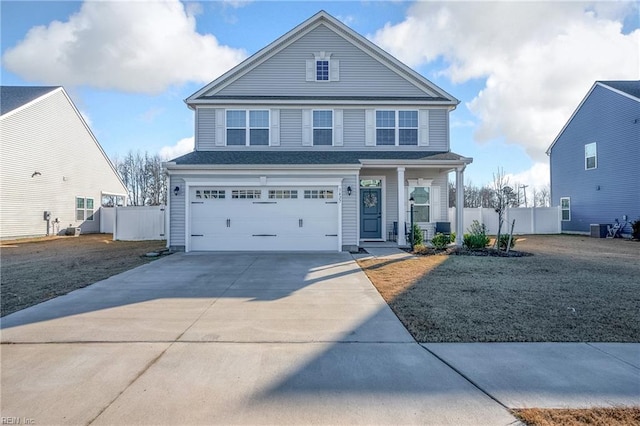 view of front property with a garage and central AC unit