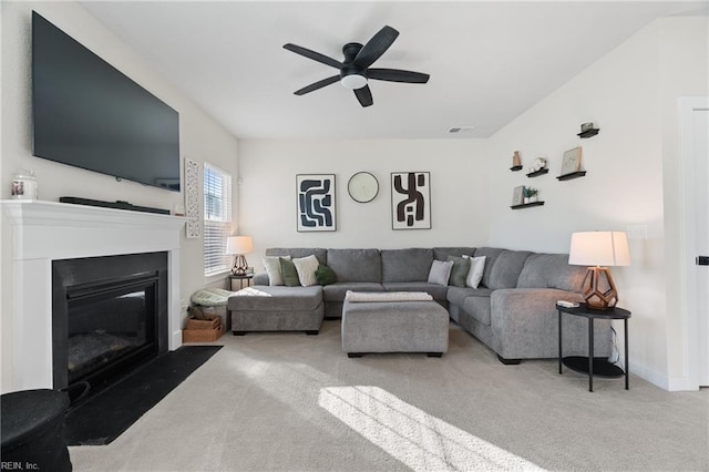 living room with carpet floors and ceiling fan