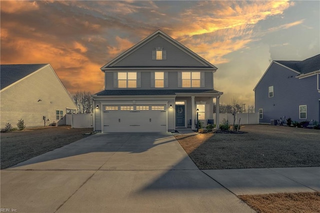 view of front of property with cooling unit and a garage