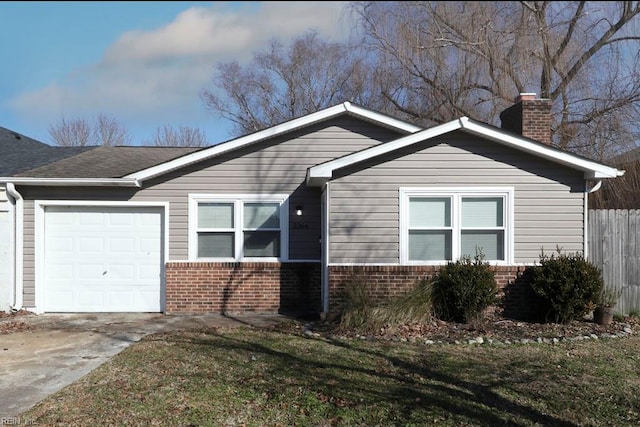 ranch-style house with a garage and a front lawn