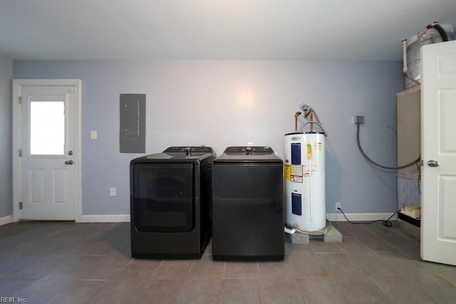 washroom featuring electric panel, water heater, and independent washer and dryer