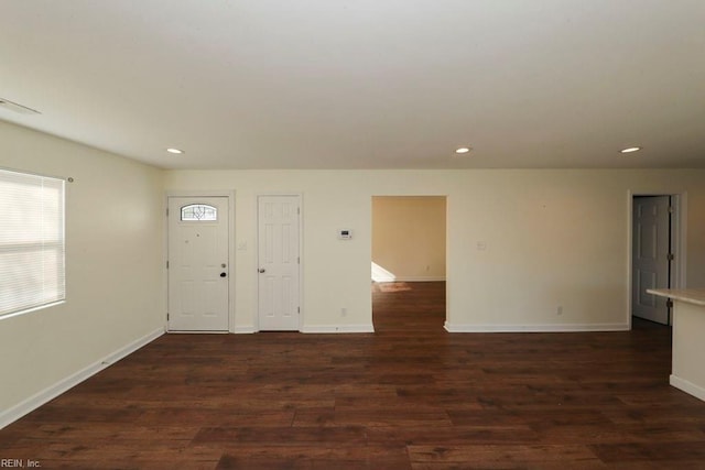 entrance foyer with dark hardwood / wood-style floors