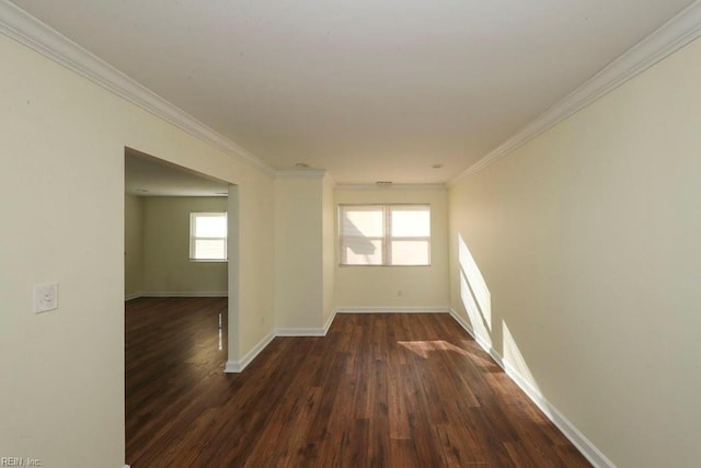 interior space with dark wood-type flooring and crown molding