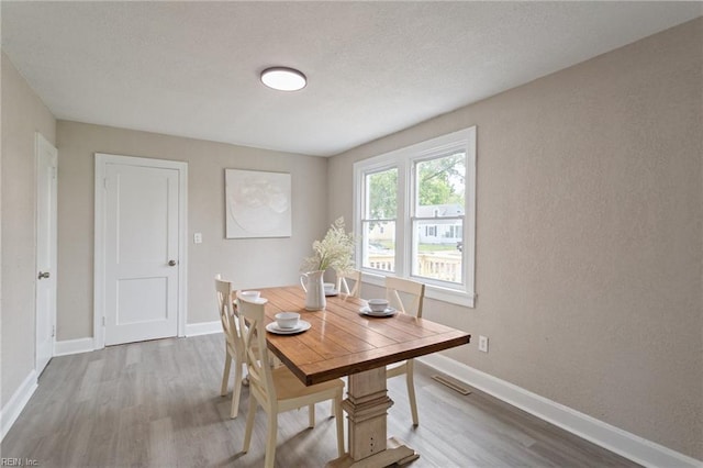 dining area featuring light hardwood / wood-style flooring